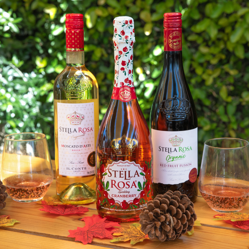 three bottles of stella rosa on a table